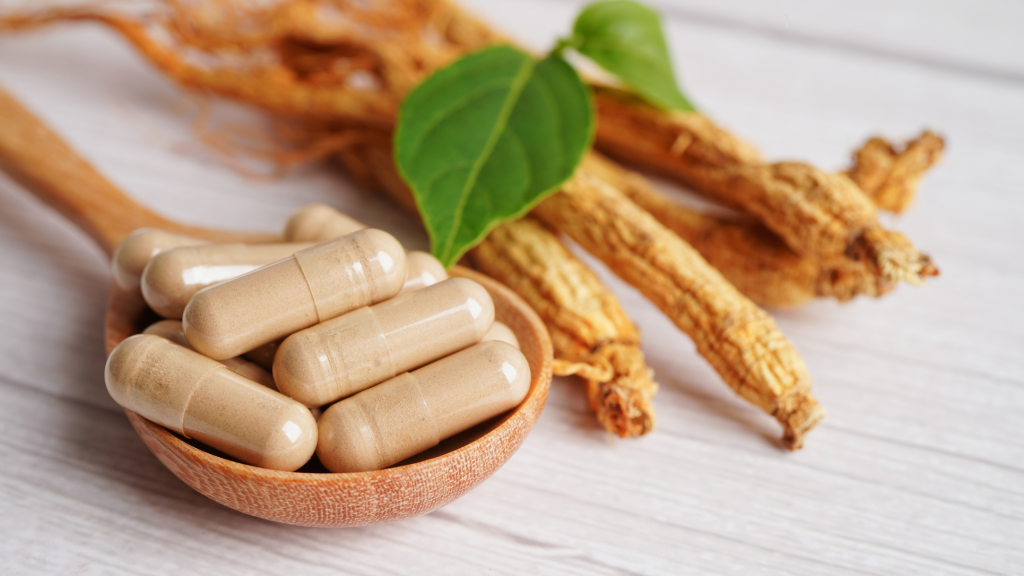 Gingseng roots and capsules on the table